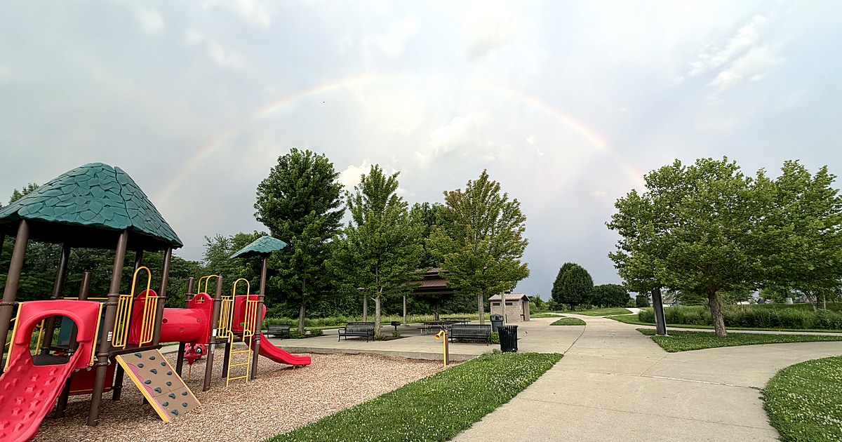 Rainbow above a playground in an Ankeny, Iowa park